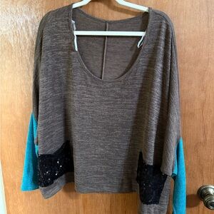 Sweater with sequin pockets